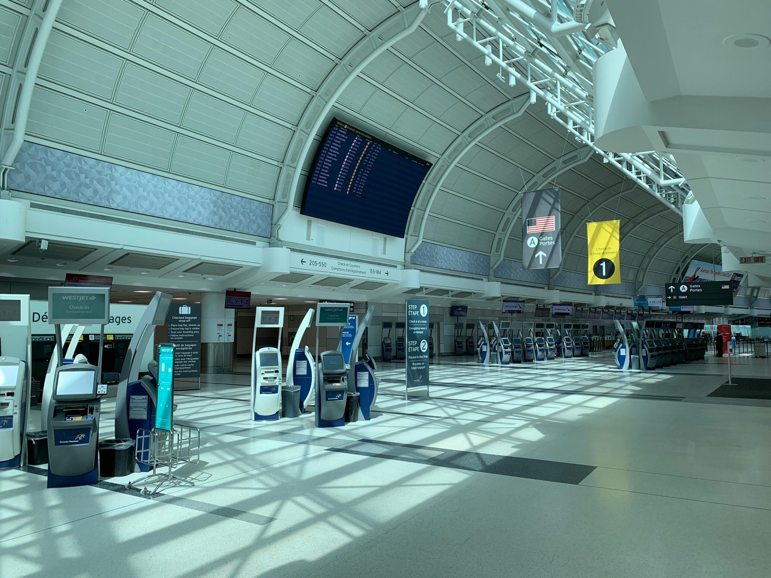 Creative design interior of contemporary airport with corridor under information board and signboards